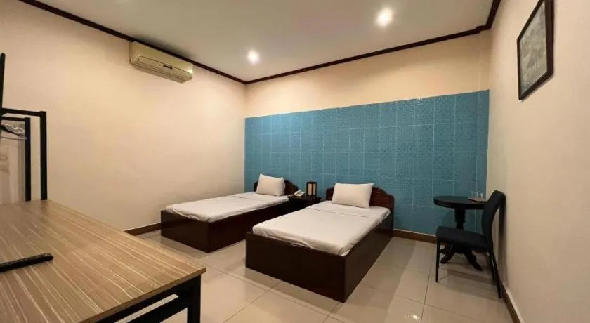 Bed in Souphaphone Hotel