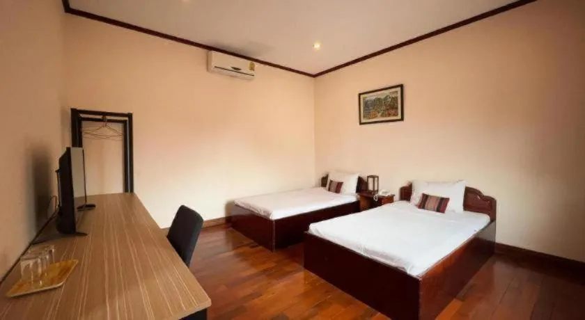 Bed in Souphaphone Hotel