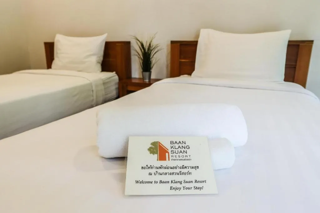 Bed in Baan Klang Suan Resort