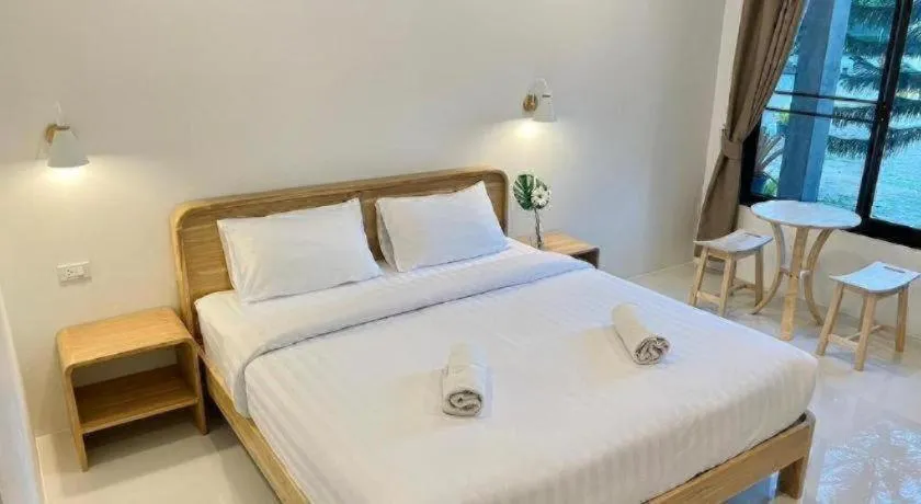 Bed in Baan Klang Suan Resort