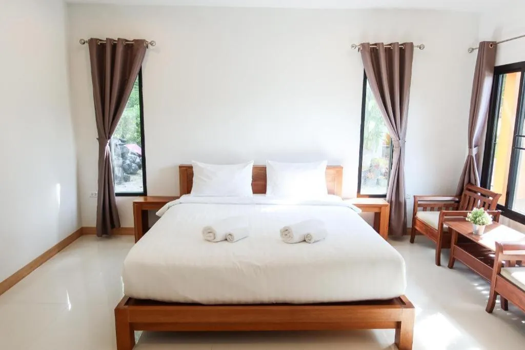 Bed in Baan Klang Suan Resort