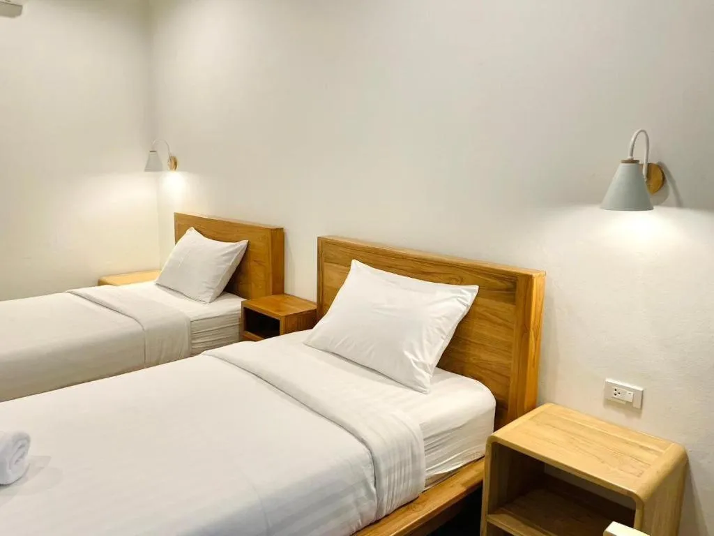 Bed in Baan Klang Suan Resort