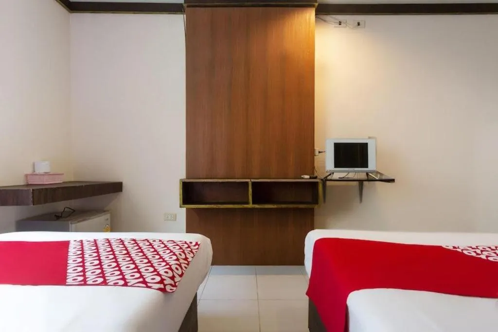 Bed in OYO 75356 Thipsiri Lodge