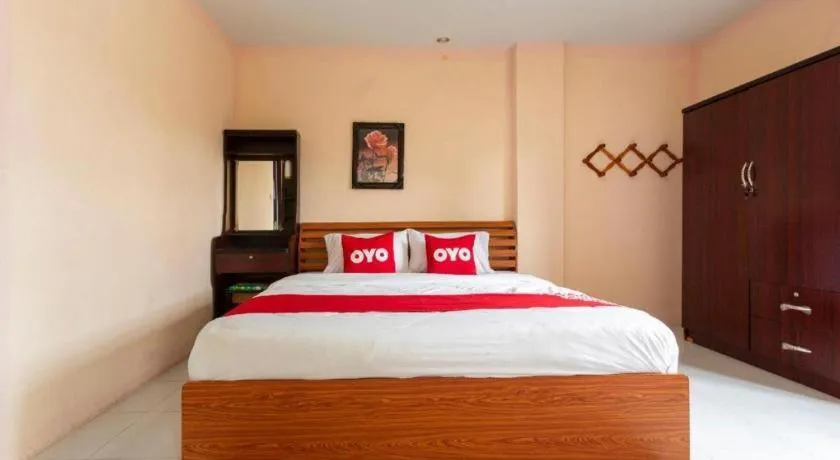 Bed in OYO 75356 Thipsiri Lodge