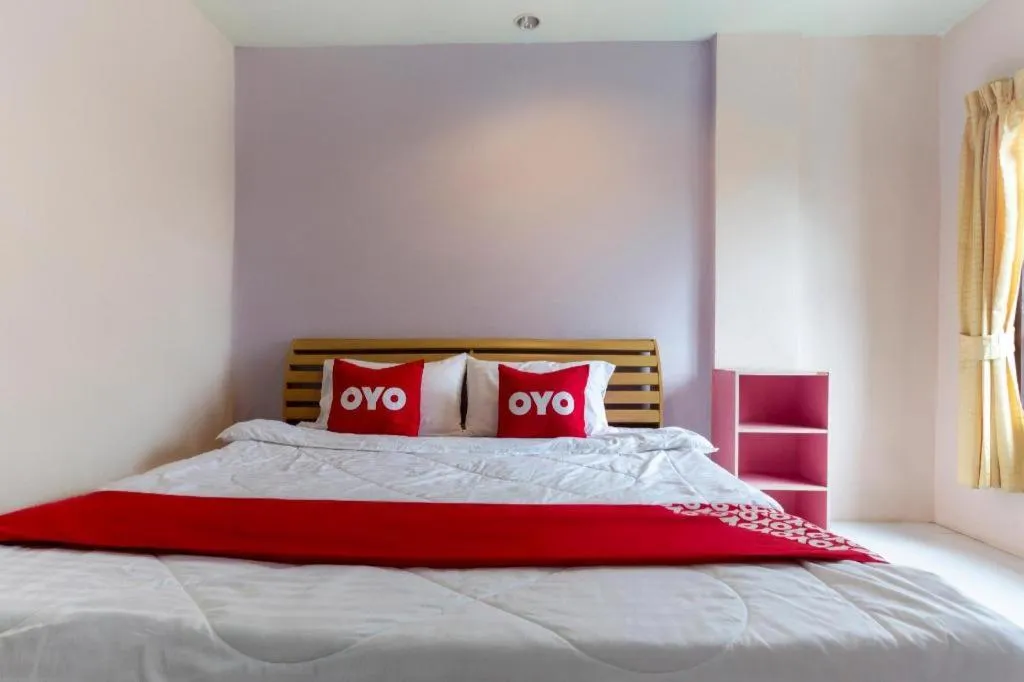Bed in OYO 75356 Thipsiri Lodge