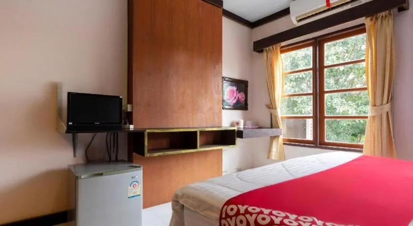 Bed in OYO 75356 Thipsiri Lodge