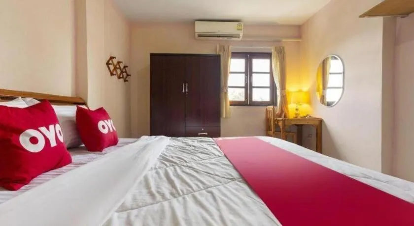 Bed in OYO 75356 Thipsiri Lodge