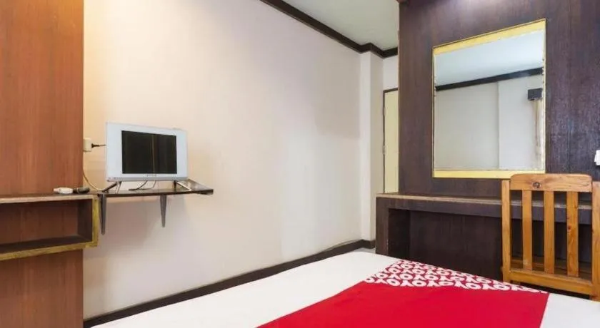 Bed in OYO 75356 Thipsiri Lodge