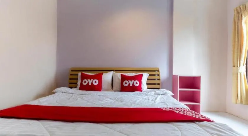 Bed in OYO 75356 Thipsiri Lodge