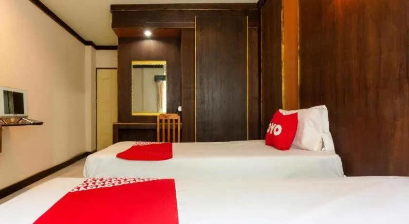 Bed in OYO 75356 Thipsiri Lodge