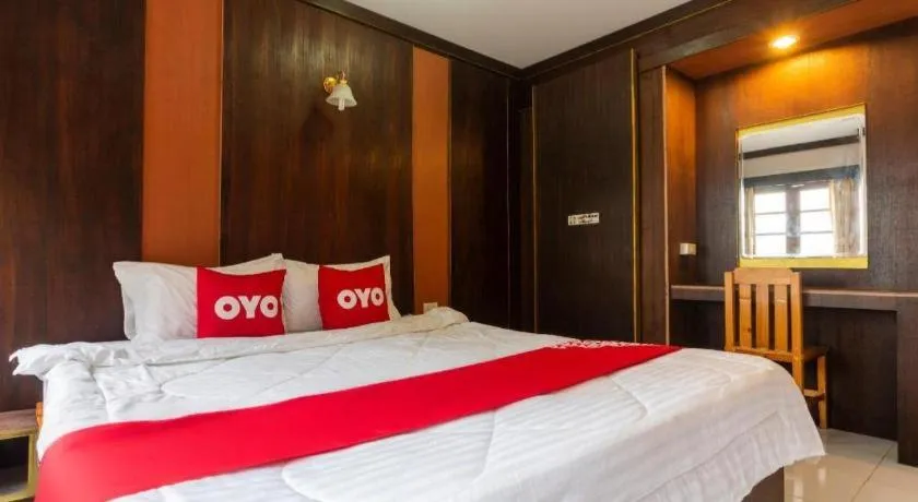 Bed in OYO 75356 Thipsiri Lodge