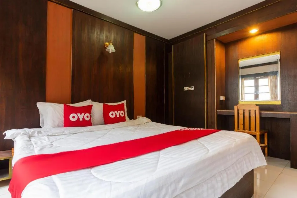 Bed in OYO 75356 Thipsiri Lodge
