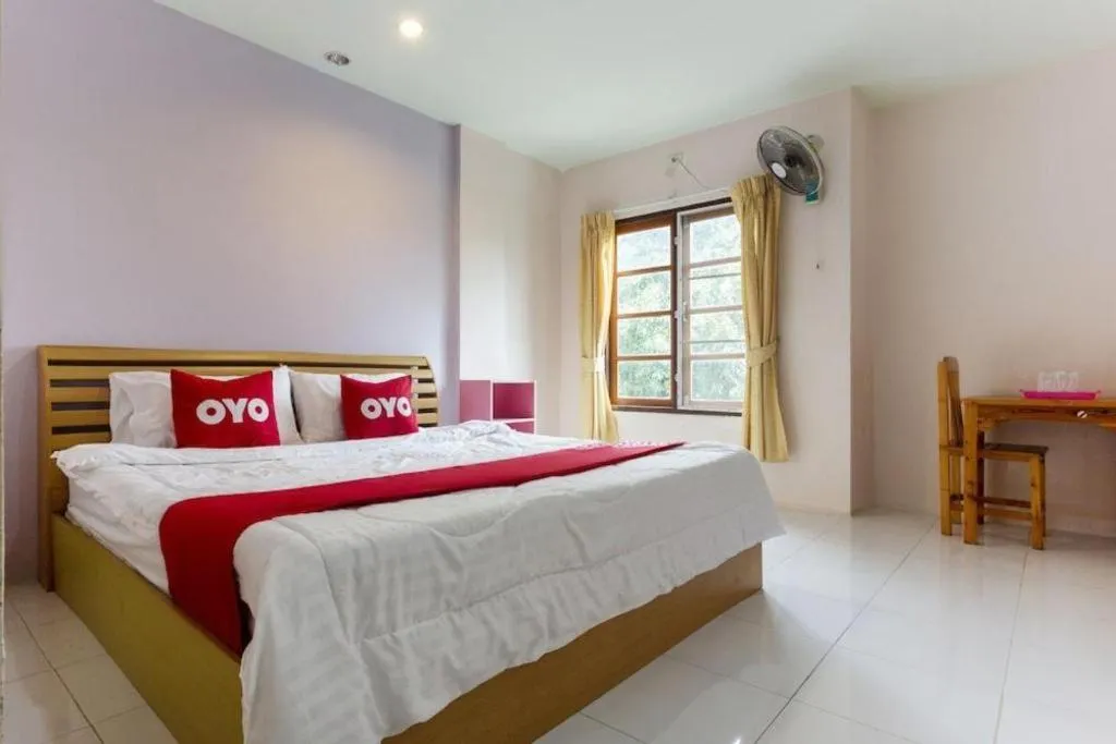 Bed in OYO 75356 Thipsiri Lodge