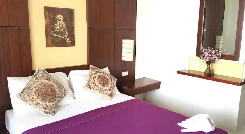 Bed in Alice in Wonderland Beach Hotel