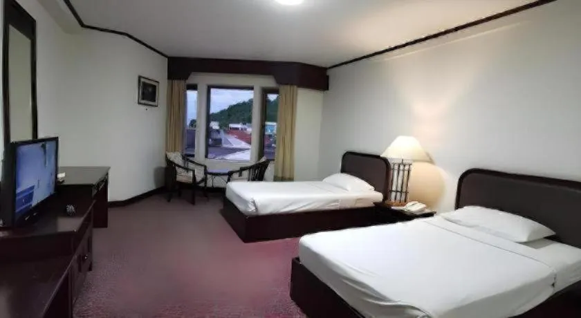 Bed in Royal Diamond Hotel