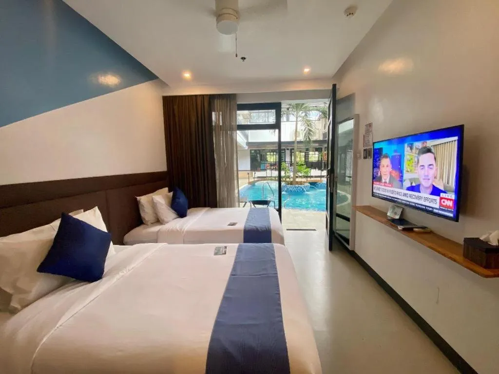 Bed in White Breeze Palawan Boutique Hotel