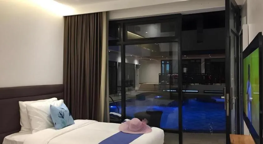 Bed in White Breeze Palawan Boutique Hotel