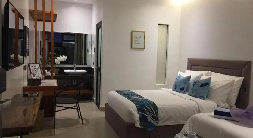 Bed in White Breeze Palawan Boutique Hotel