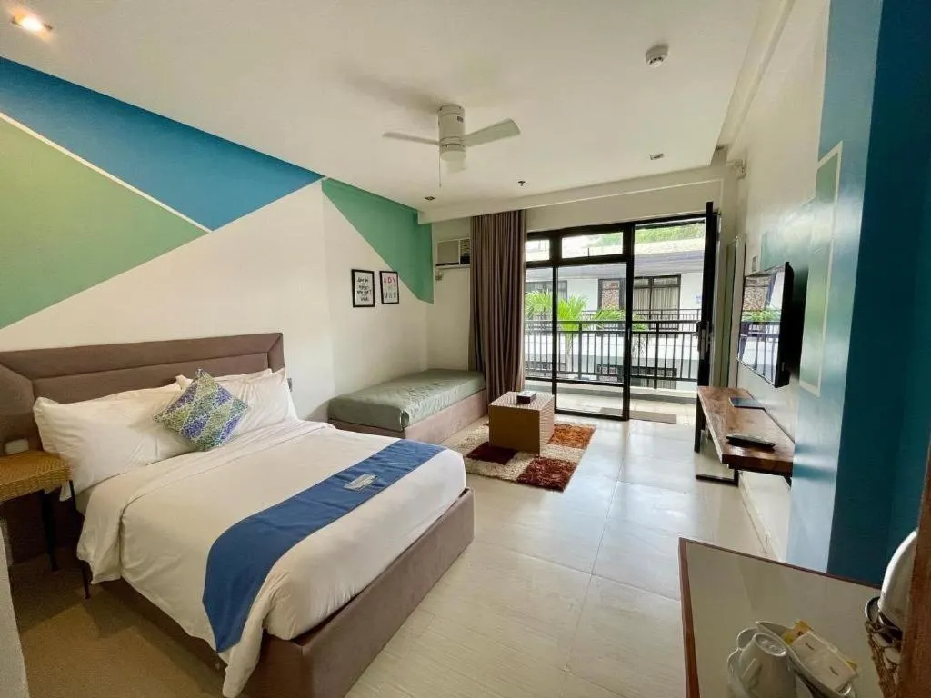 Bed in White Breeze Palawan Boutique Hotel