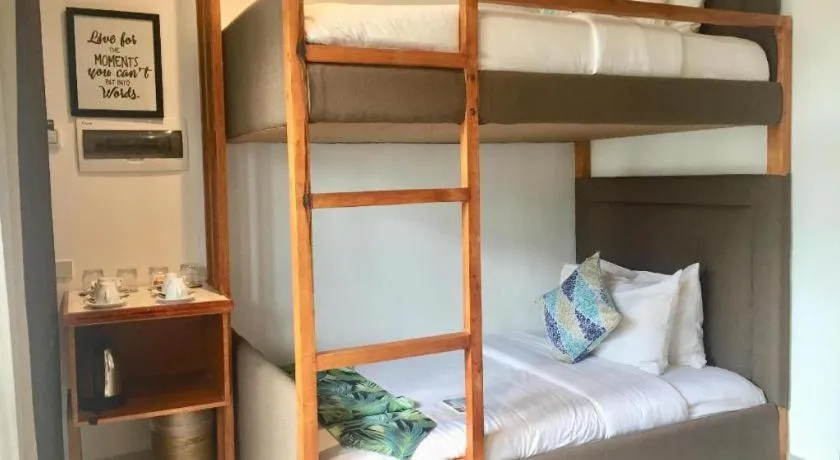 Bed in White Breeze Palawan Boutique Hotel