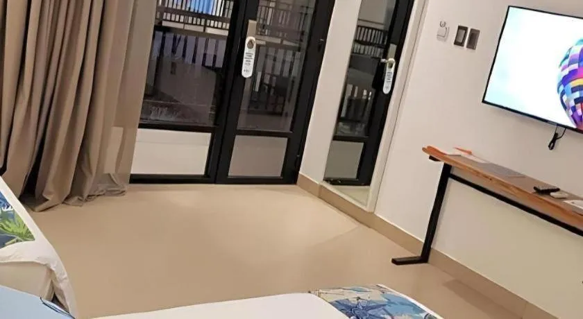 Bed in White Breeze Palawan Boutique Hotel