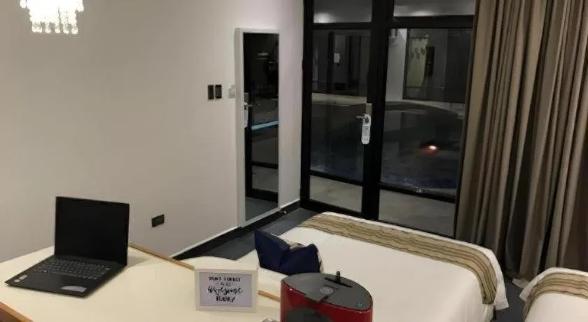 Bed in White Breeze Palawan Boutique Hotel