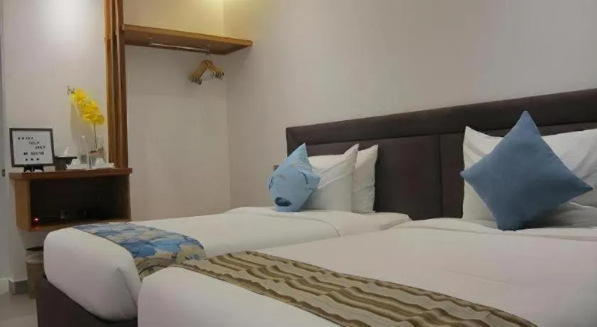 Bed in White Breeze Palawan Boutique Hotel