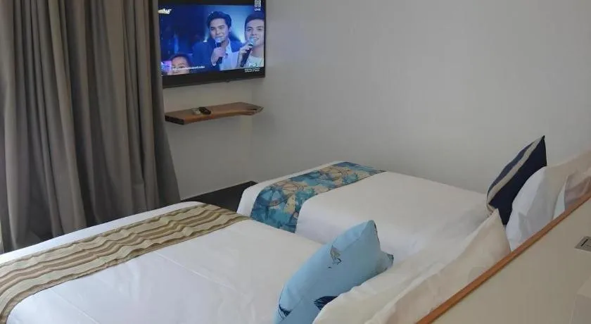Bed in White Breeze Palawan Boutique Hotel