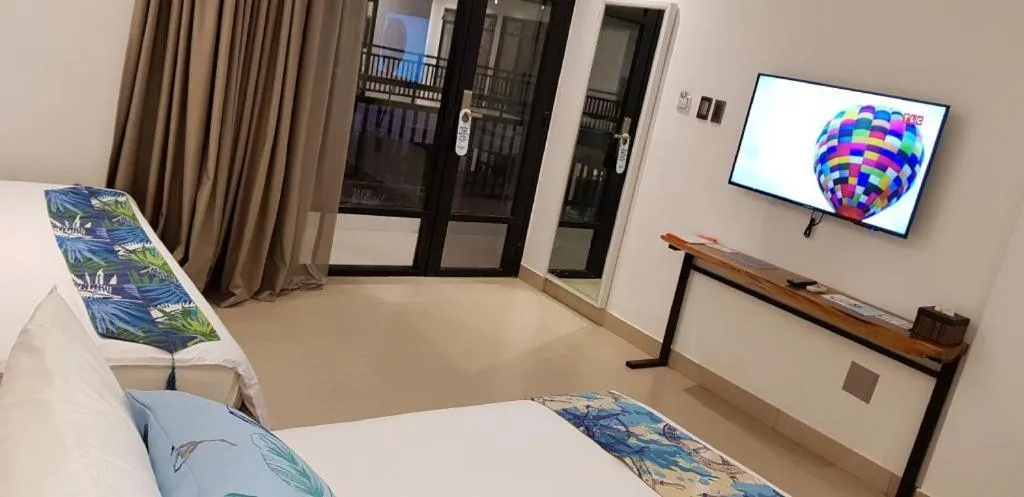 Bed in White Breeze Palawan Boutique Hotel