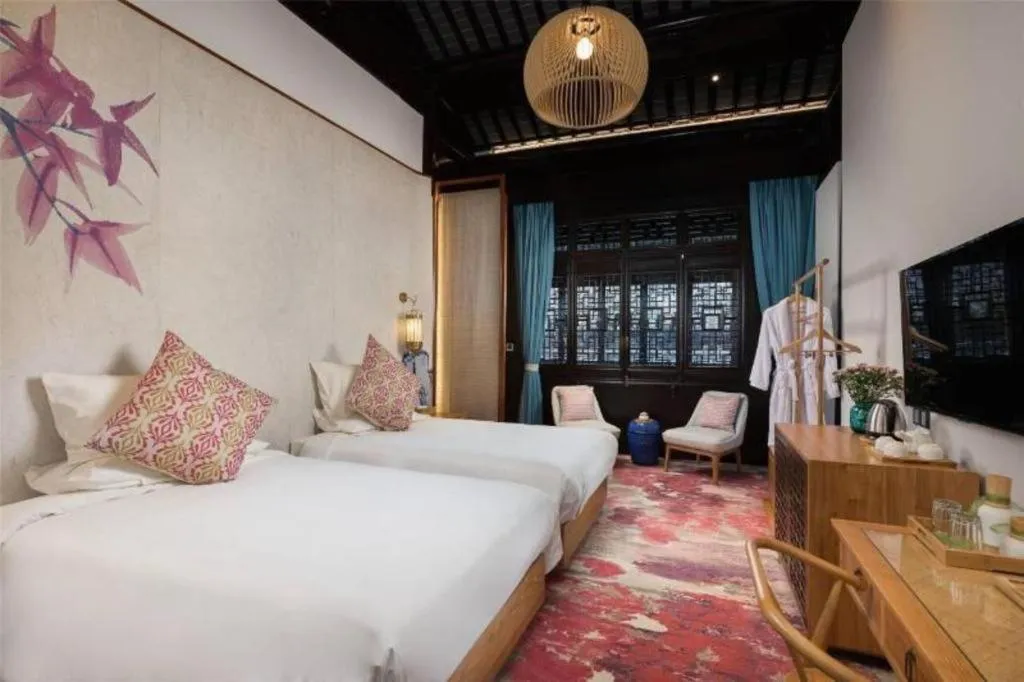 Bed in Blossom Hill Inn Suzhou Tanhuafu
