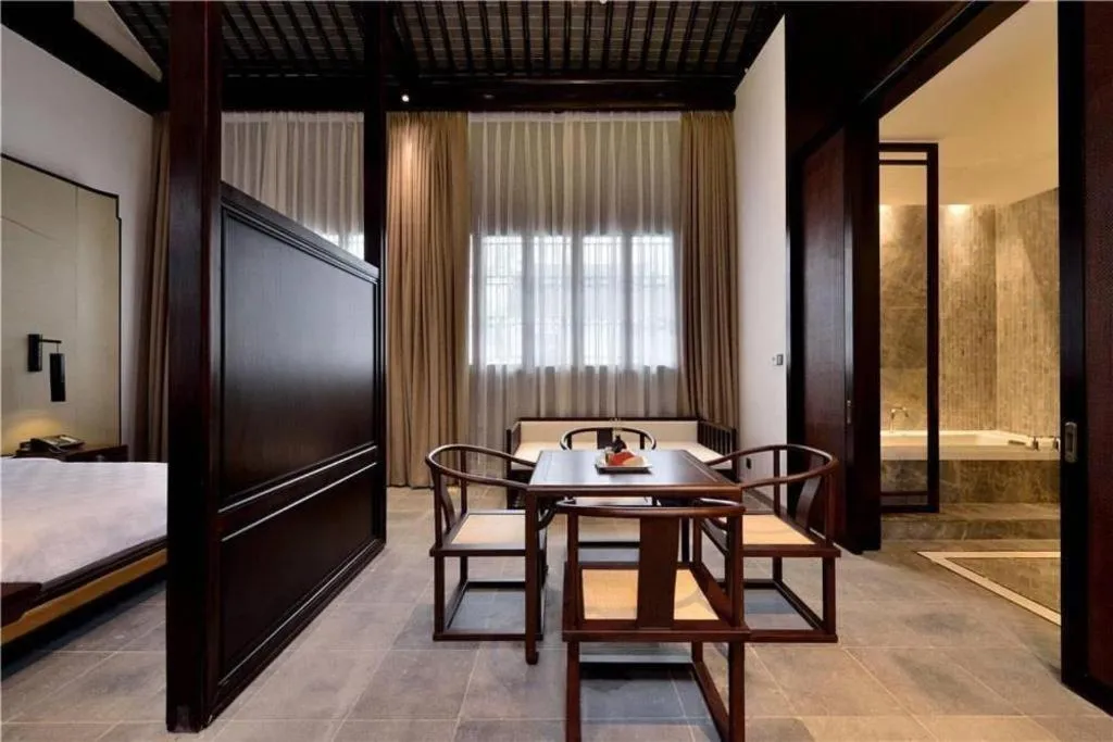 Bed in Blossom Hill Inn Suzhou Tanhuafu