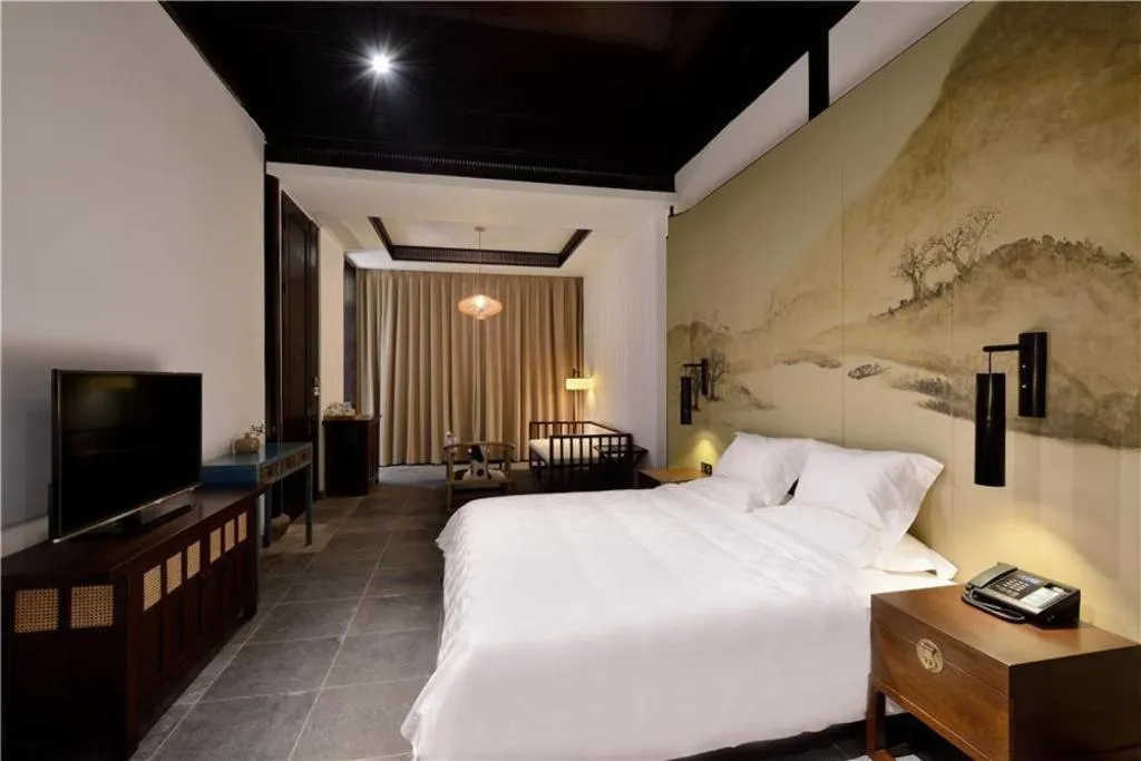 Bed in Blossom Hill Inn Suzhou Tanhuafu