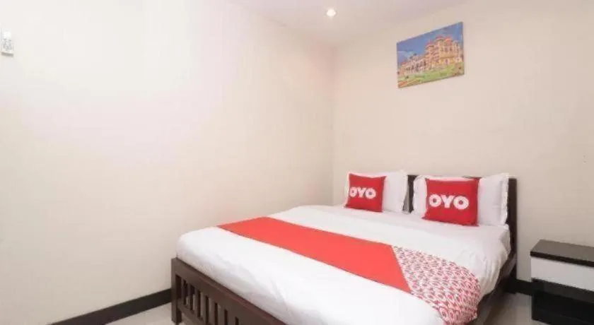 Bed in OYO 253 KK 11 Boutique Inn