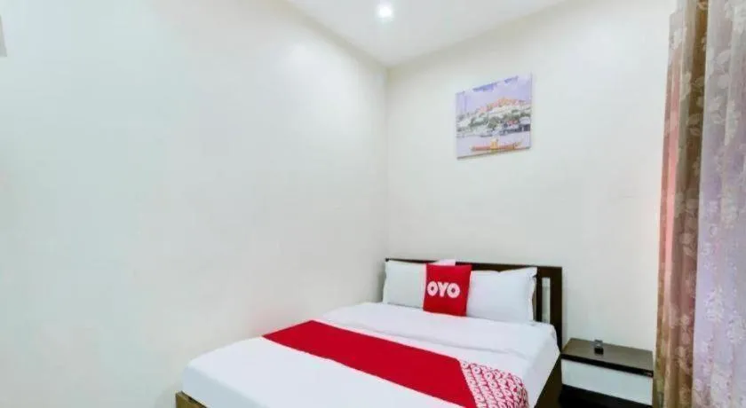 Bed in OYO 253 KK 11 Boutique Inn