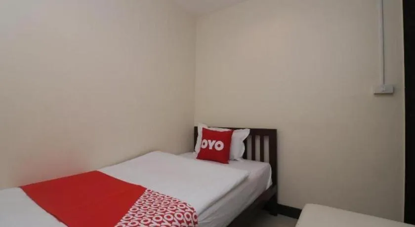 Bed in OYO 253 KK 11 Boutique Inn