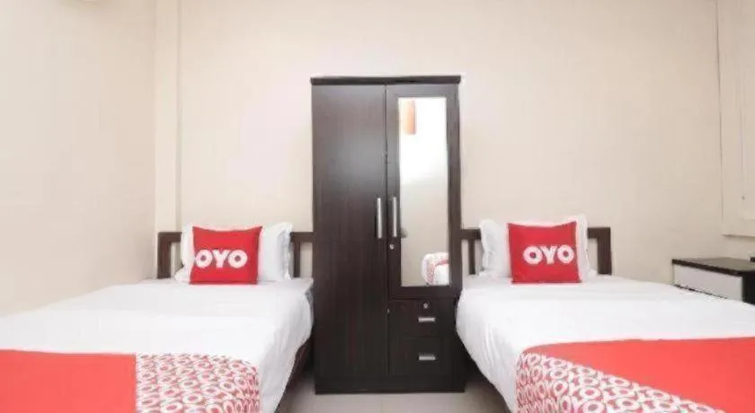 Bed in OYO 253 KK 11 Boutique Inn