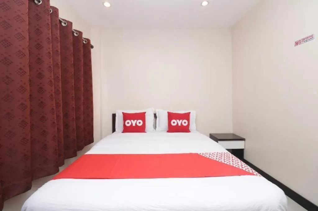 Bed in OYO 253 KK 11 Boutique Inn