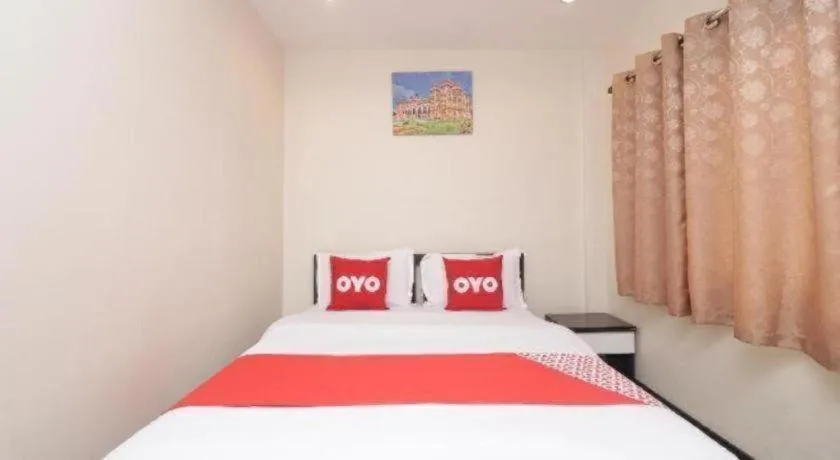 Bed in OYO 253 KK 11 Boutique Inn