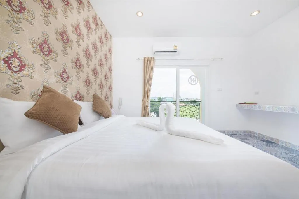 Bed in Oasis Hiso Hotel