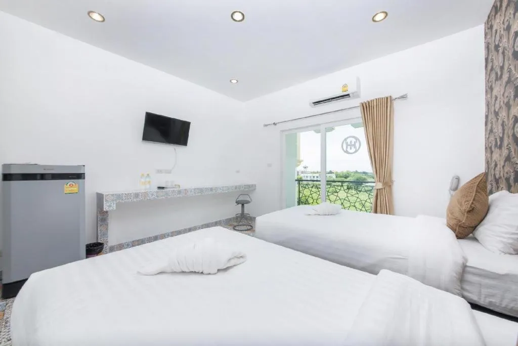 Bed in Oasis Hiso Hotel