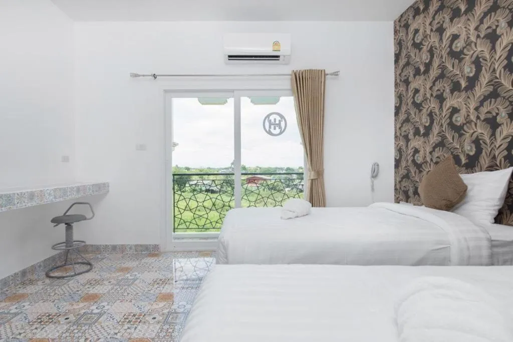 Bed in Oasis Hiso Hotel