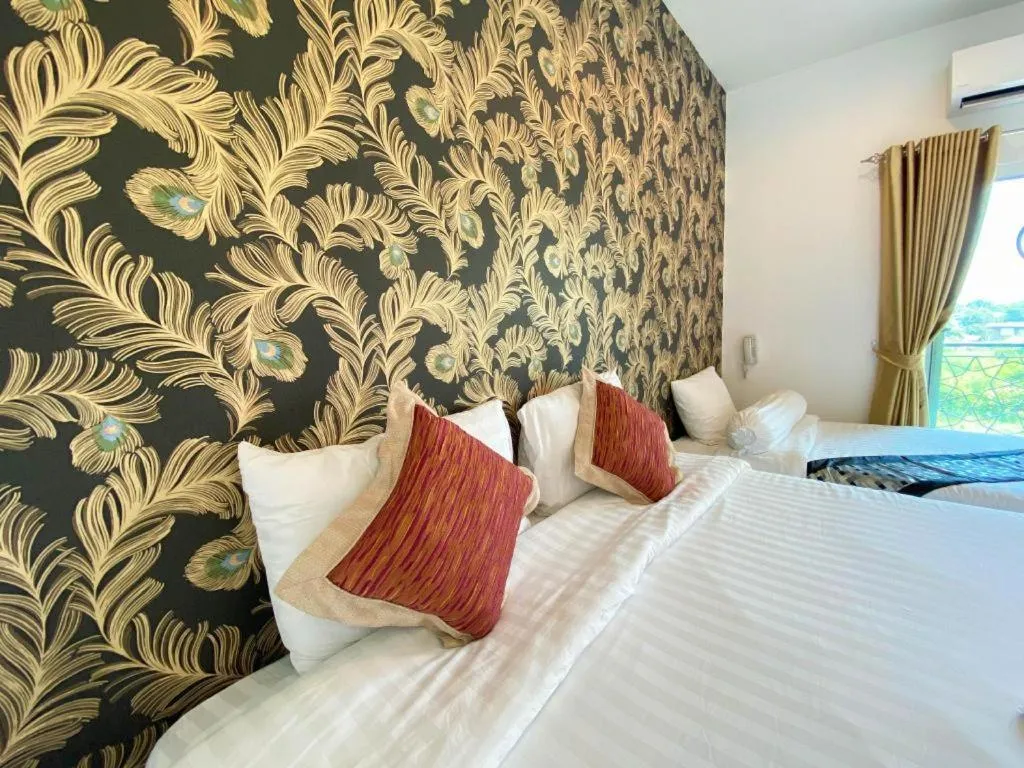 Bed in Oasis Hiso Hotel