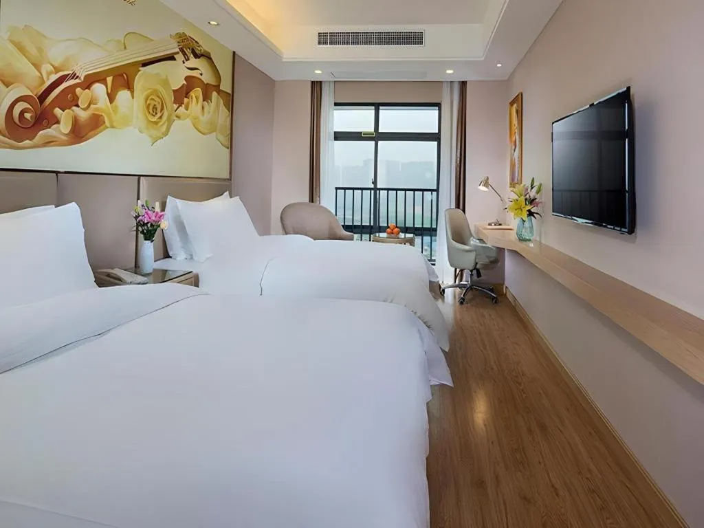 Bed in Vienna Hotel Nanning Xiangsi Lake University Town