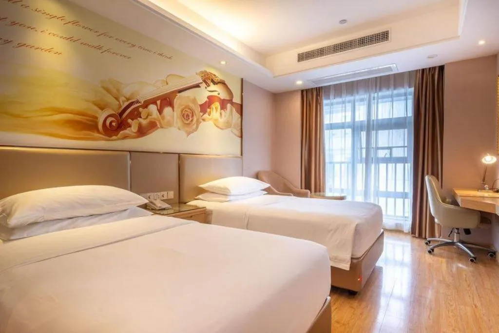 Bed in Vienna Hotel Nanning Xiangsi Lake University Town