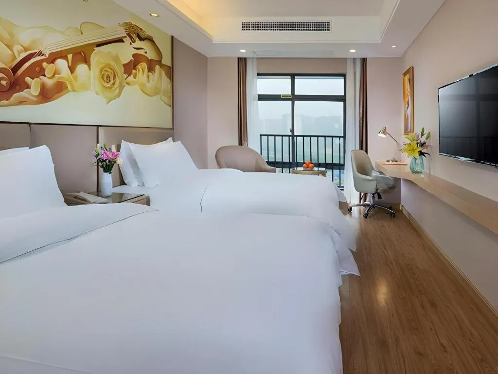 Bed in Vienna Hotel Nanning Xiangsi Lake University Town