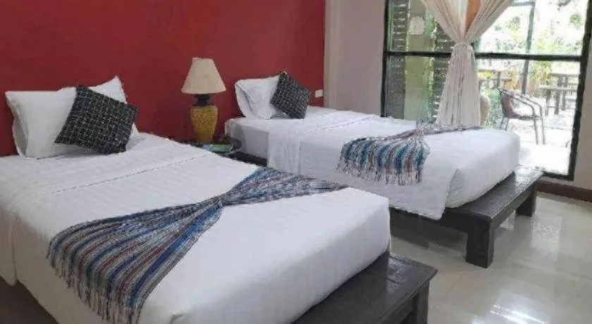 Bed in Sawasdee River Kwai Lodge