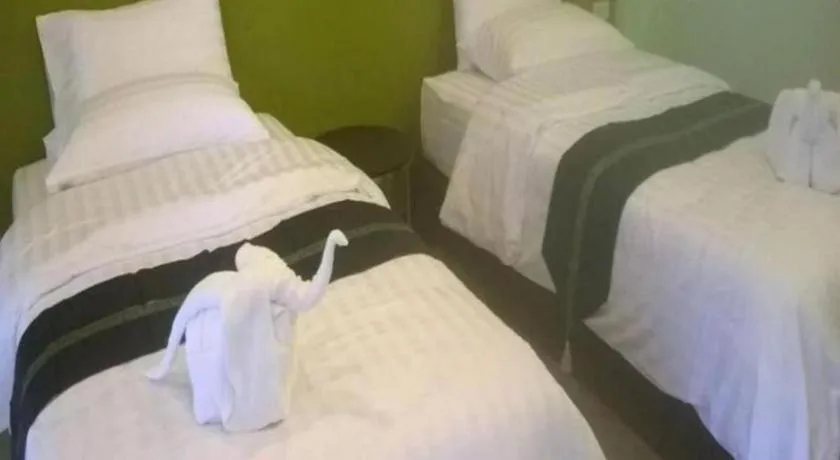 Bed in Sawasdee River Kwai Lodge