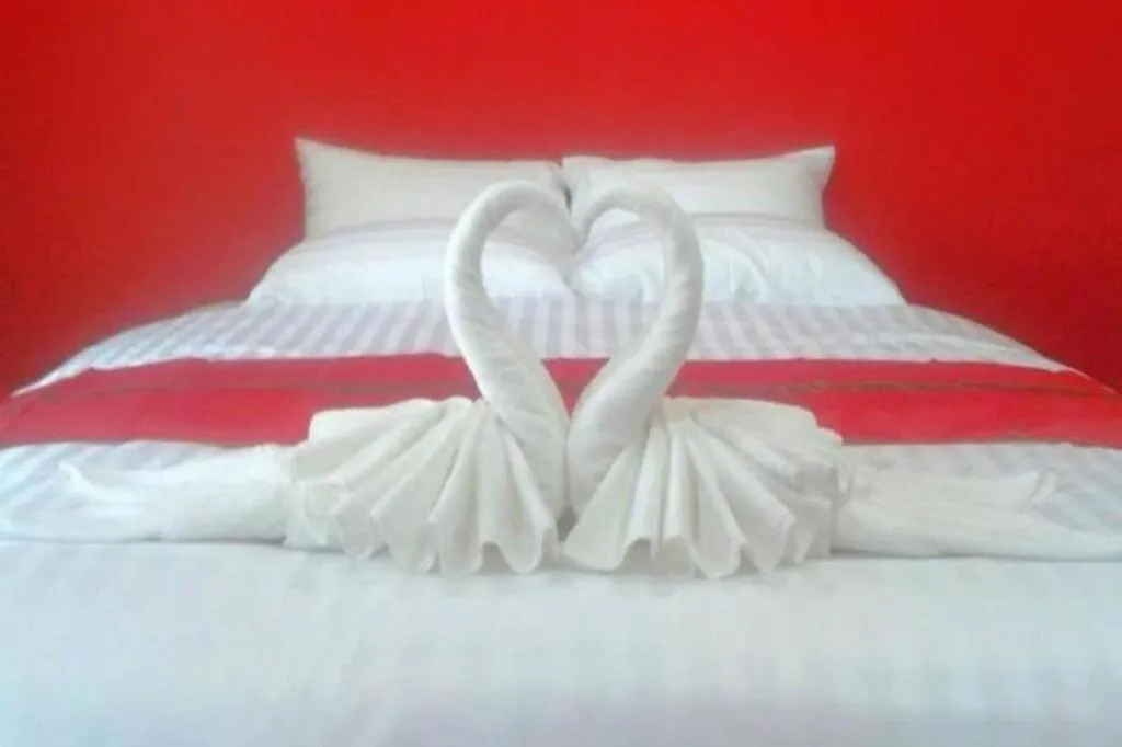 Bed in Sawasdee River Kwai Lodge