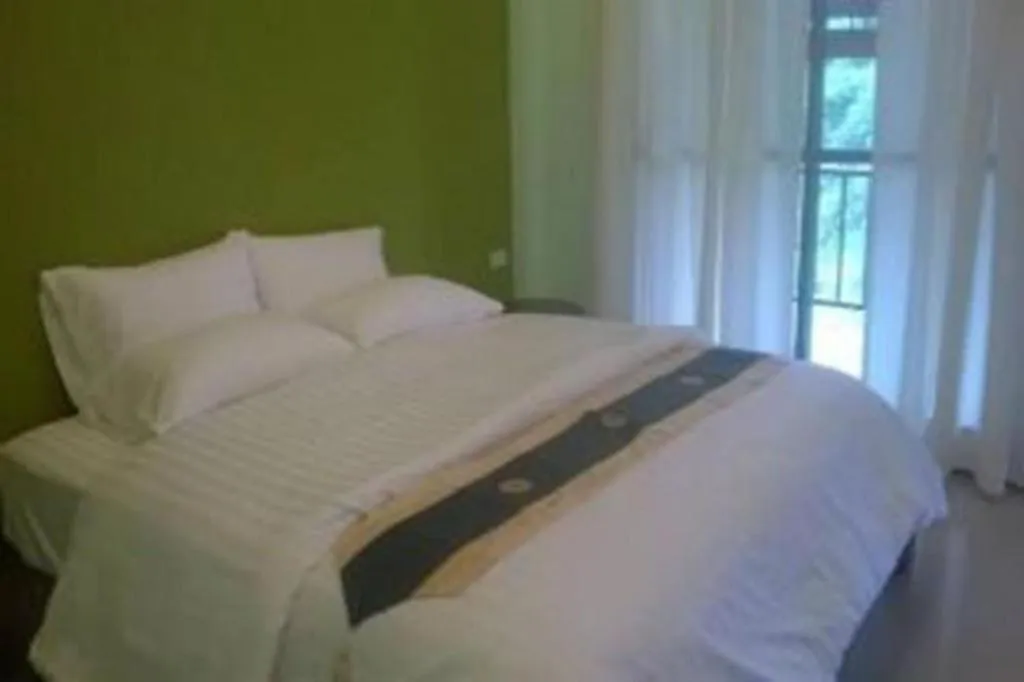 Bed in Sawasdee River Kwai Lodge