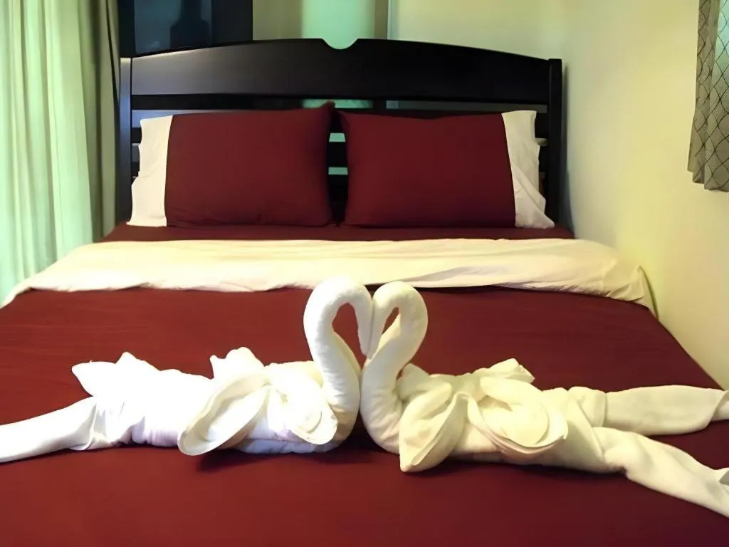 Bed in Green Cottage Beach Resort